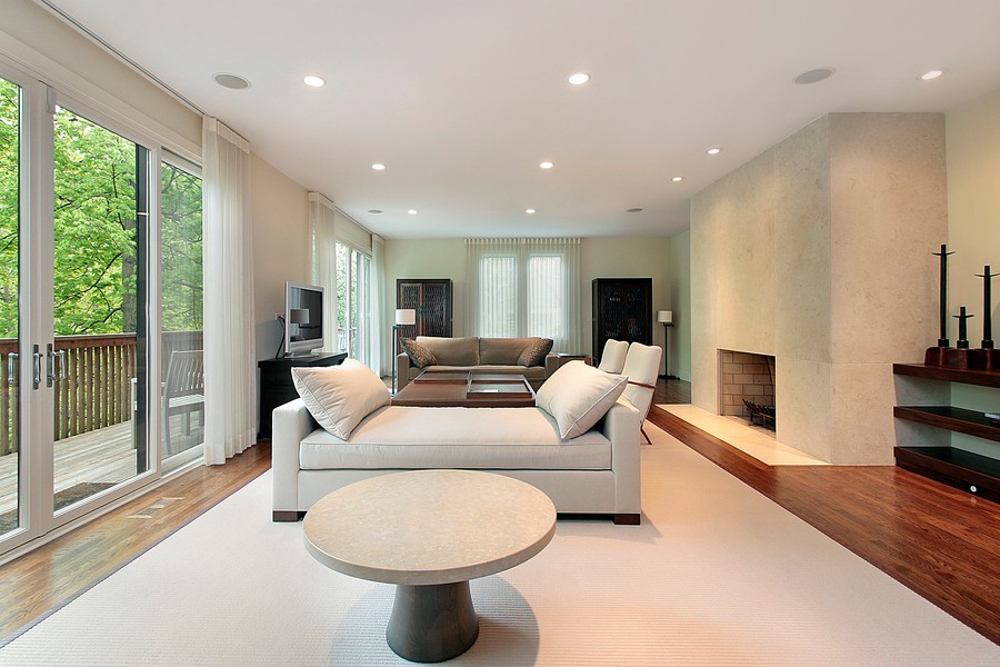 Image is of a beige living room in a smart home.