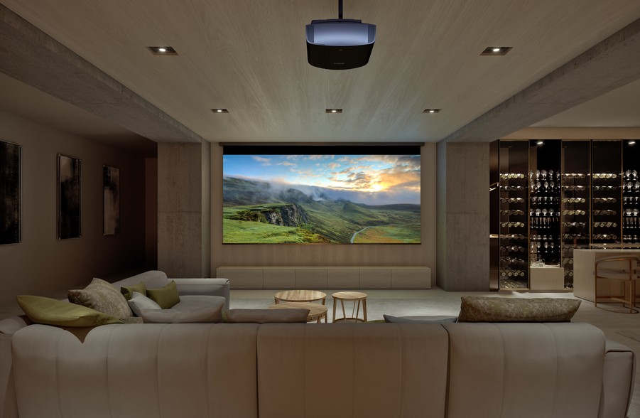 A media room featuring a Sony ceiling-mounted projector and motorized screen.